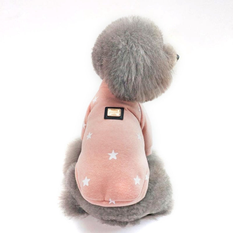 Pink star-pattern pet sweater with plush hood and logo patch, dog seated facing away
