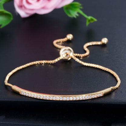 Adjustable yellow-gold zircon single-row curved bracelet with clasp