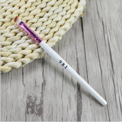 Angled eyebrow makeup brush with white handle and purple ferrule, fine tapered bristles