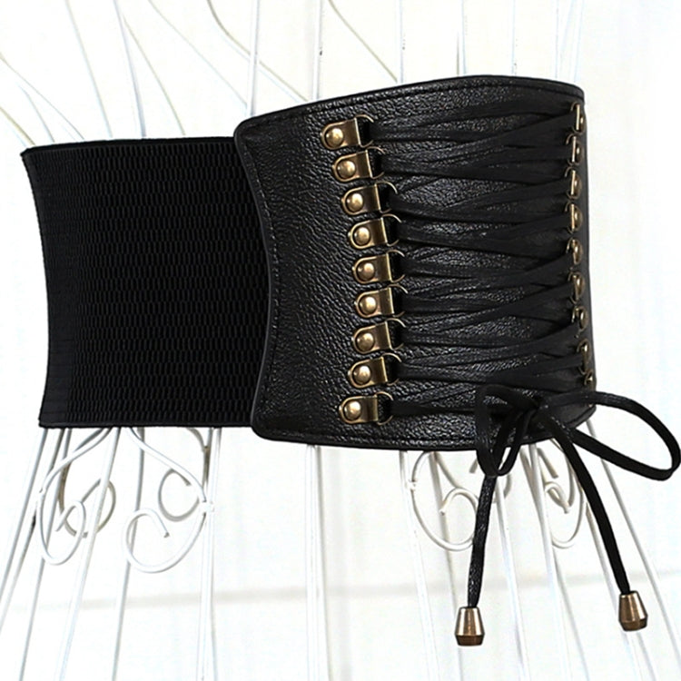 Black wide lace-up elastic belt with metal eyelets and dangling tie tassels