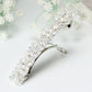 Rhinestone elastic hair clip with clear crystal-like stones, silver metal