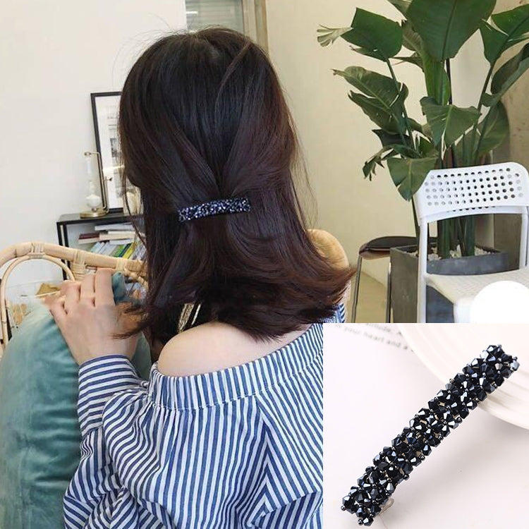 Girls rhinestone elastic hair clip, dark navy crystal bar on brown hair