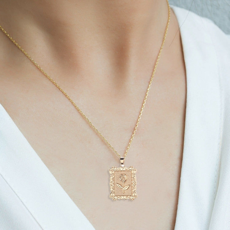 Gold geometric square rose pendant necklace on collarbone with thin chain