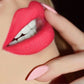 Liquid matte lipstick applying bright red matte color to lips with wand