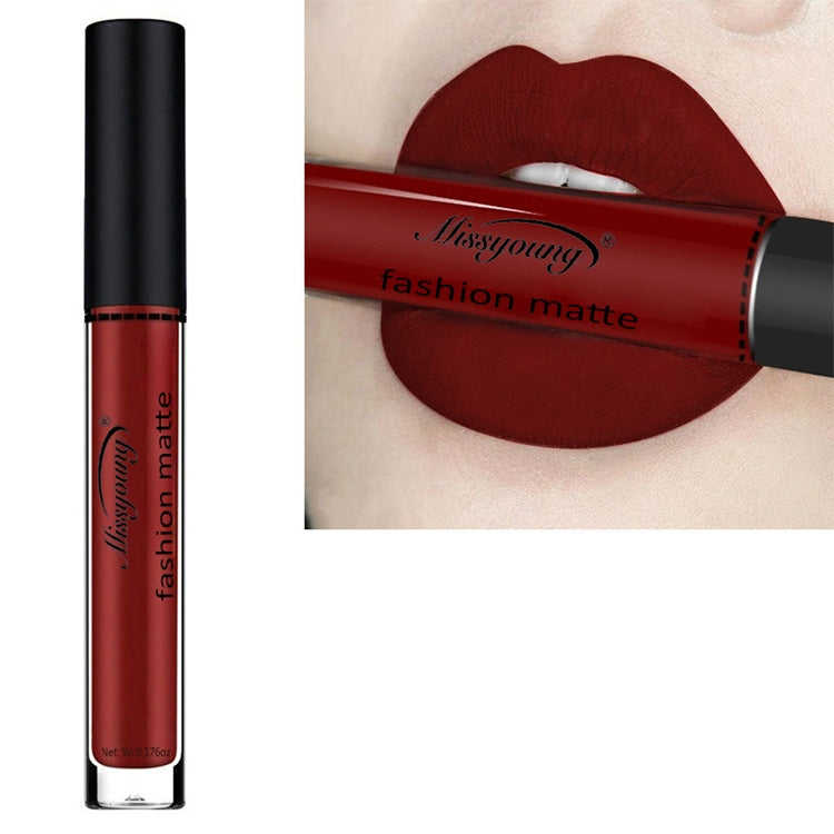 Matte liquid lipstick with deep red-burgundy shade, long-wearing lip color in a clear tube