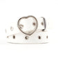 White narrow leather belt with silver heart buckle and round grommet studs