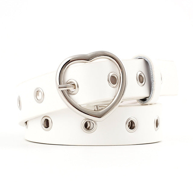 White narrow leather belt with silver heart buckle and round grommet studs