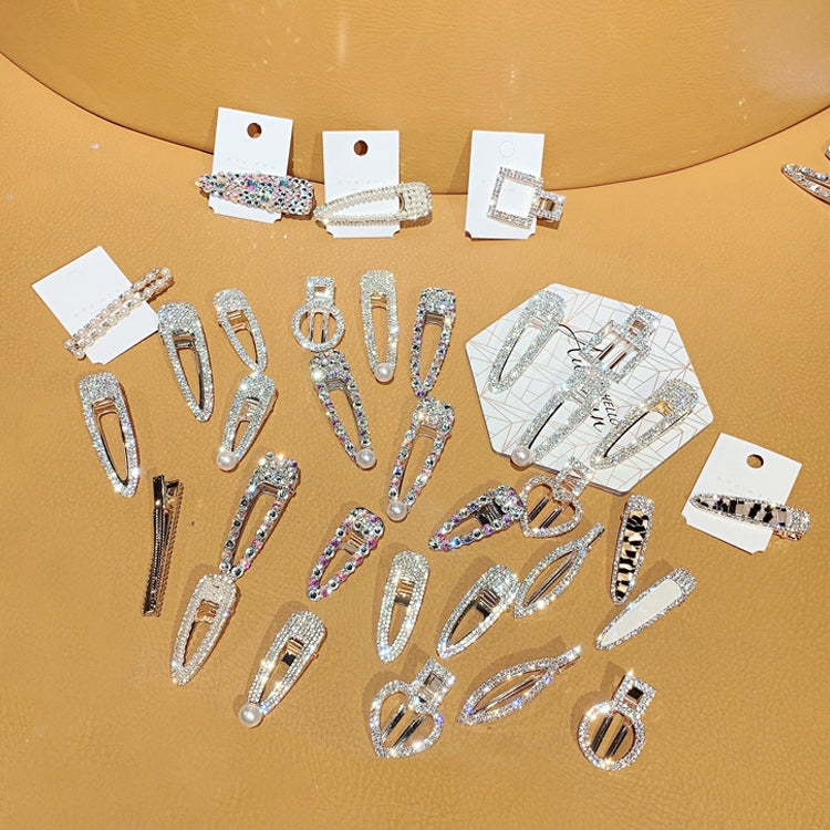 Assorted rhinestone and faux pearl hair barrettes in rectangle and oval shapes