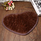 Heart-shaped bath mat, brown plush with stitched non-slip border