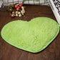 Heart-shaped non-slip bath mat, light green with textured fuzzy pile and edge trim