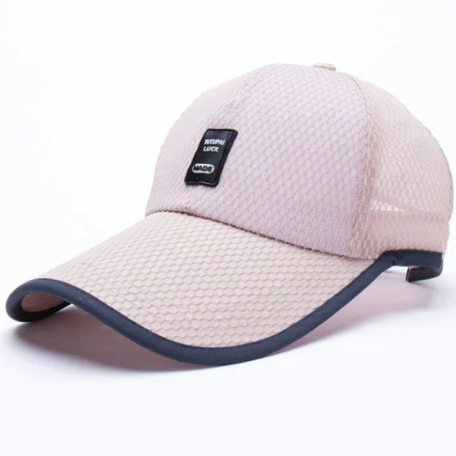 Breathable mesh baseball cap in beige with curved brim and mesh side panel.