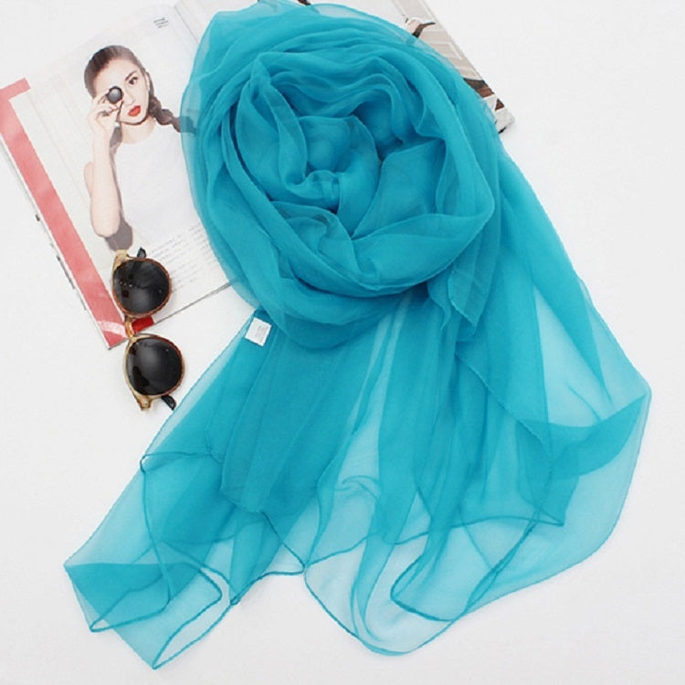 Teal chiffon silk scarf with a soft rose-like fold, sheer lightweight fabric