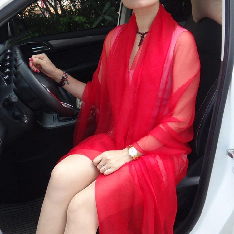 Red chiffon silk scarf, sheer wrap draped over shoulders with flowing folds