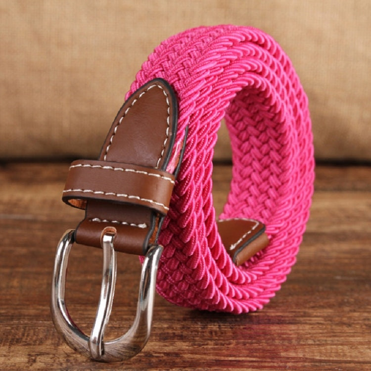 Narrow woven elastic belt with silver buckle, bright pink braided canvas, brown keeper.