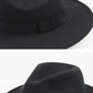 Black wide-brim hat with fabric band detail and curved brim edge.