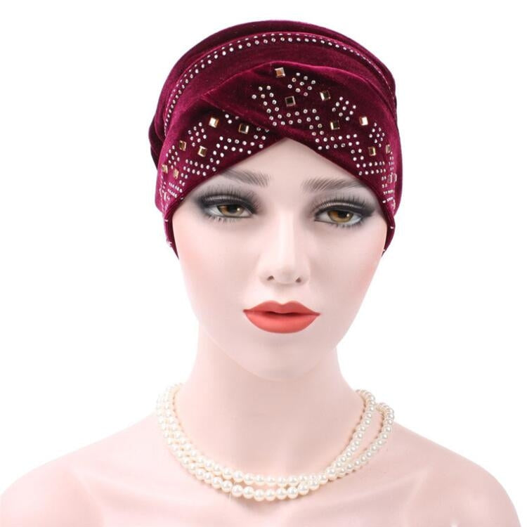 Red wine pleuche turban hat with rhinestone trim and square pattern across front