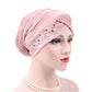 Adjustable rhinestone turban hat in light pink with sparkling bead trim
