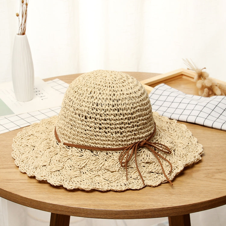 Beige straw foldable sun hat with braided ribbon bow and wide brim