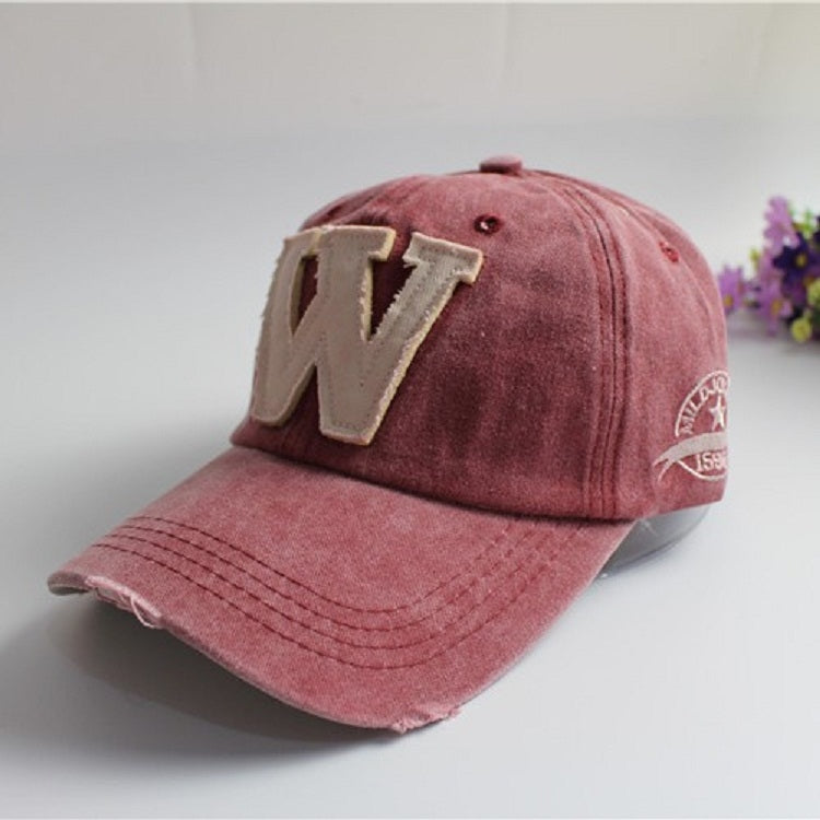 Wine red canvas baseball cap with light beige 'W' applique and red side badge