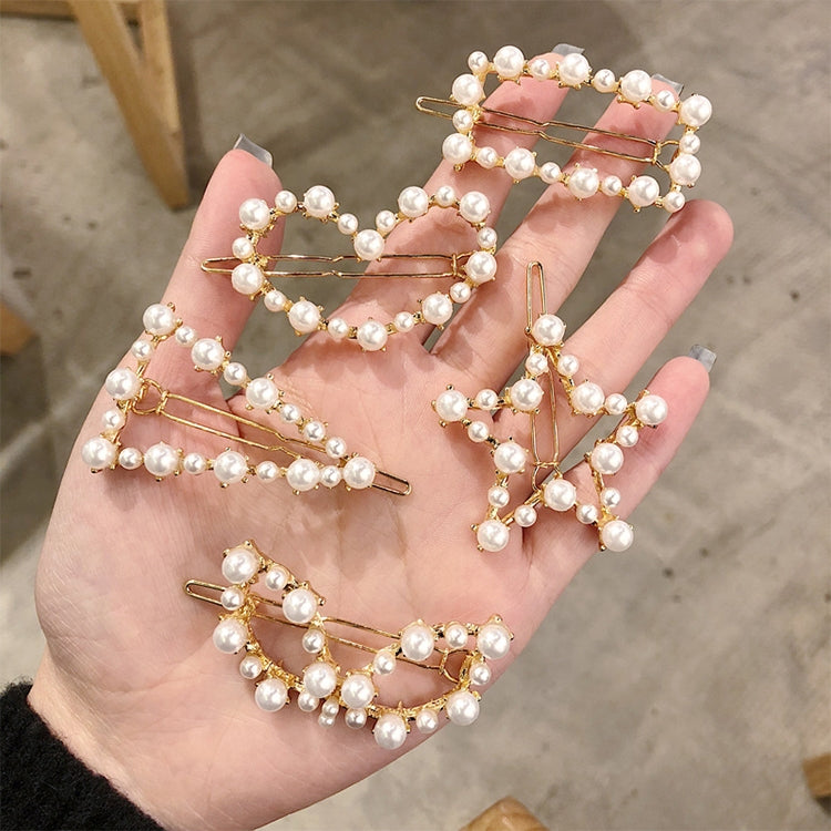 Set of pearl hair clips with gold-tone frames and white bead details