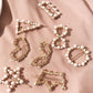 Assorted pearl hair clips with gold-tone frames and white bead accents