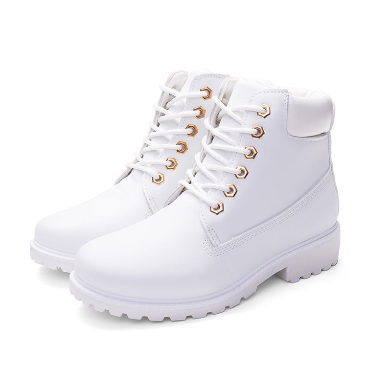 White pair of lace-up Martin boots with side panel stitching and chunky outsole