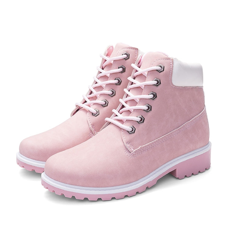 Pink lace-up warm ankle boots with padded collar, metal eyelets, and rugged tread sole