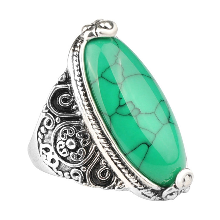 Antique silver oval green cabochon ring with ornate filigree flower band
