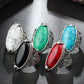 Antique silver oval gemstone rings with turquoise, white, black, and red settings