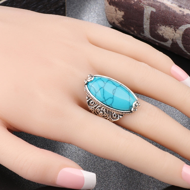 Antique silver turquoise blue oval cabochon ring worn on finger