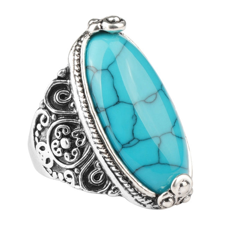 Antique silver oval turquoise blue cabochon ring with decorative filigree sides