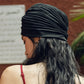 Black turban head wrap, back view with ribbed swirl and full coverage