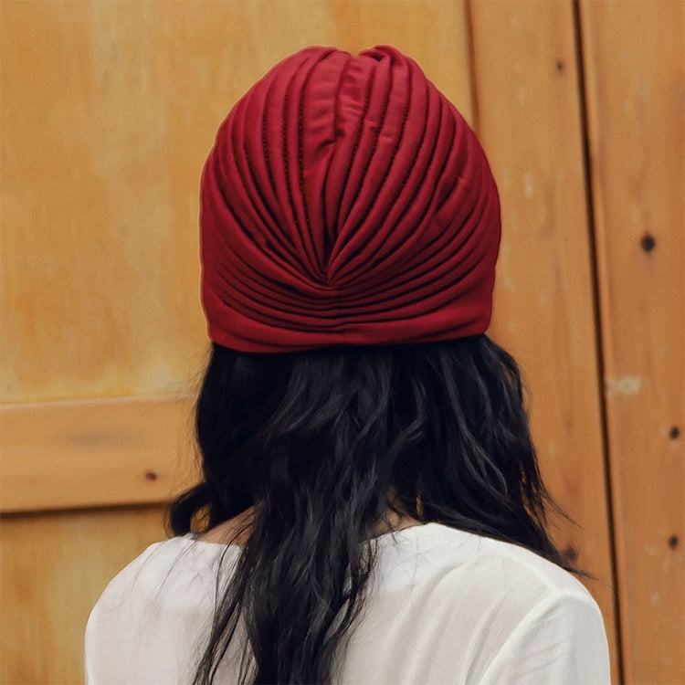 Red turban head wrap on woman, gathered dome top and ribbed texture