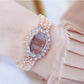 Rose gold octagonal rhinestone bracelet watch with brown dial and jeweled bezel
