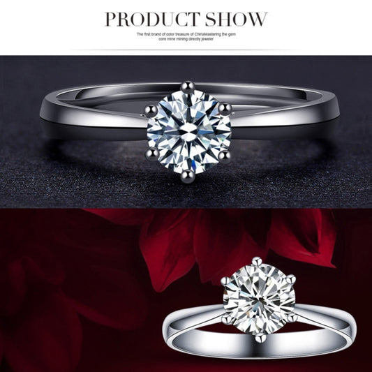 Silver-toned ring with large round CZ center stone and six-prong crown