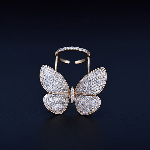 Butterfly-shaped adjustable ring with pavé stones in gold tone