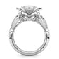 Silver ring front view with filigree details and central round stone