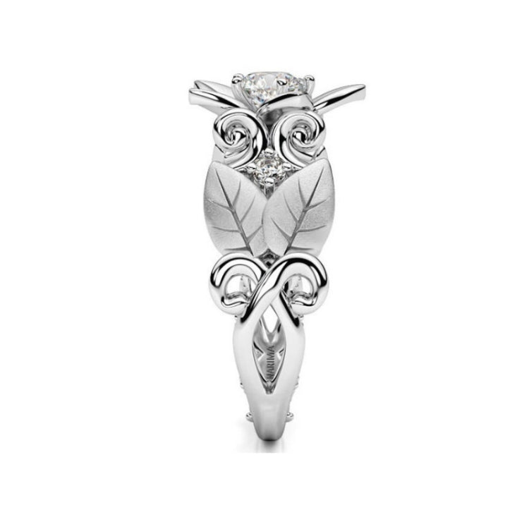 Silver owl-inspired ring with small stones and leaf-texture accents