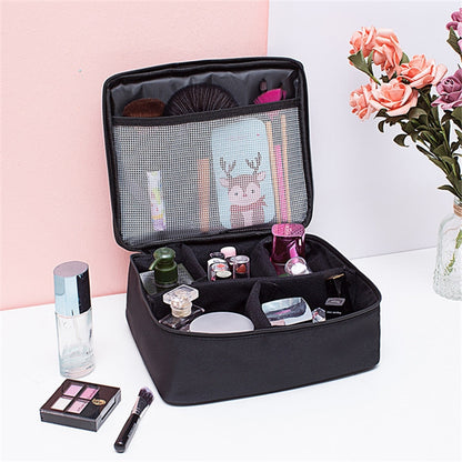 Large black cosmetic bag with zip opening and interior net pocket, organized compartments.