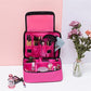 Pink large cosmetic bag open with brush compartments and see-through mesh pocket.