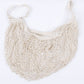 Cream mesh tote bag with long handles and open woven net design