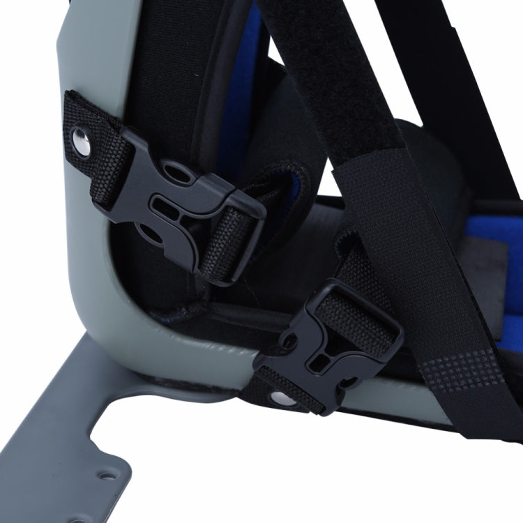 Close-up of black straps on light gray ankle brace with buckles and fasteners
