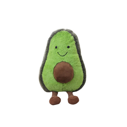 Green avocado plush pillow toy with brown center, stitched smile, and small brown feet