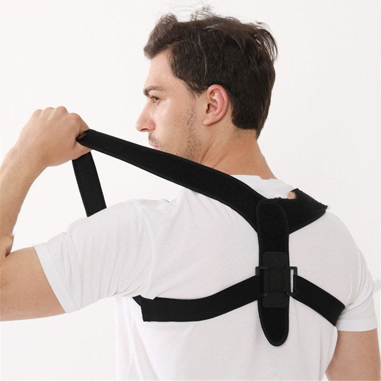 Black shoulder strap brace worn over a white shirt; straps across upper back