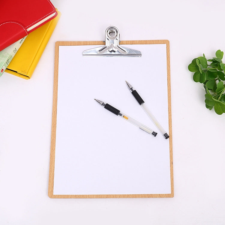 Wood clipboard with metal clip, holding blank sheet