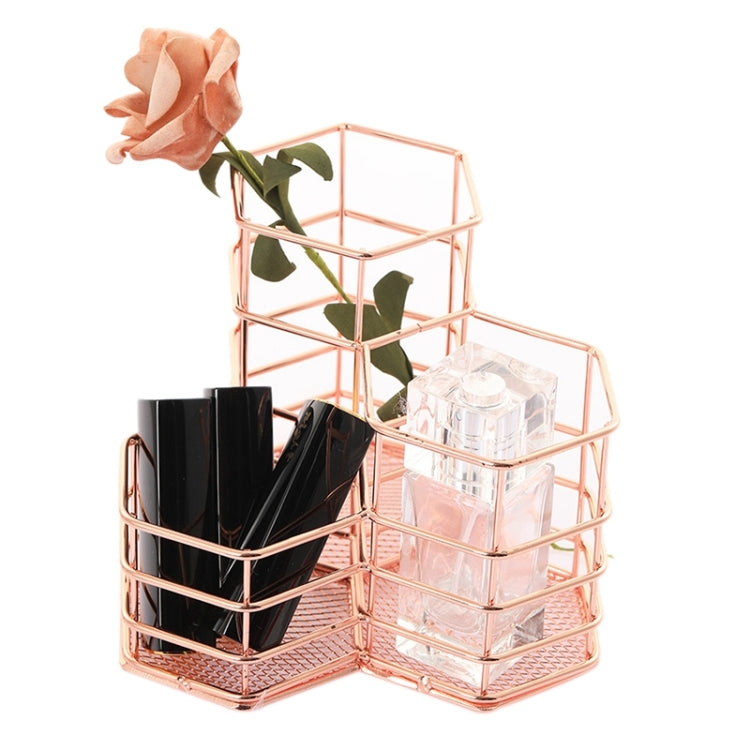 Rose gold hexagonal wire organizer with clear side bin and black cup-like holders inside
