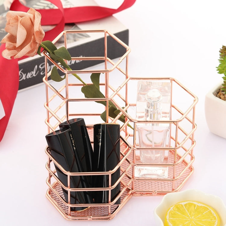 Rose gold hexagonal organizer with clear acrylic bins and black brush pen holders inside