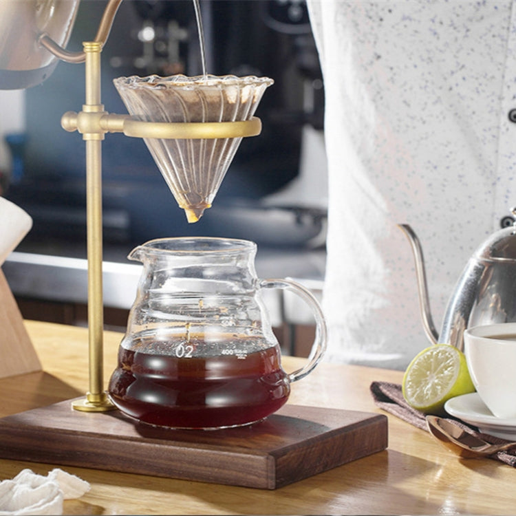 Brass hand coffee filter holder with glass carafe and paper filter cone