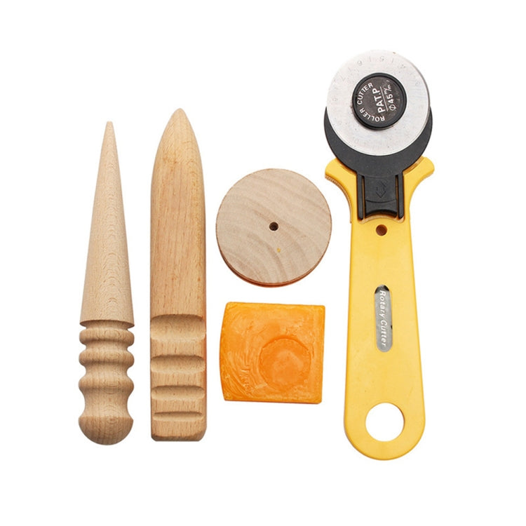 Leather sewing tool assortment with wooden needle, spool, and specialty strap cutter