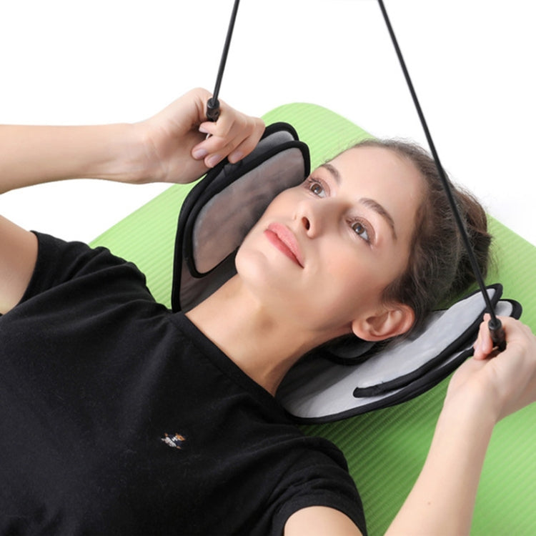 Neck stretcher eye mask and cervical hammock worn by a reclining person